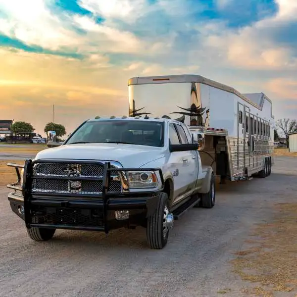 Truck towing livestock trailer