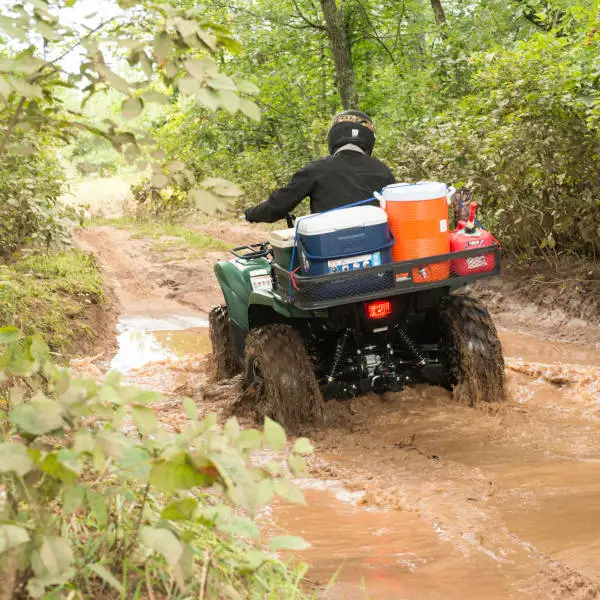 CURT ATV Cargo Carrier on Muddy Trail