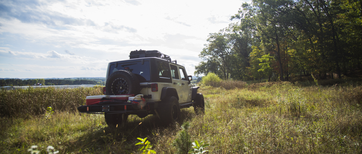 CURT hitch cargo carrier and rooftop cargo carrier on Jeep