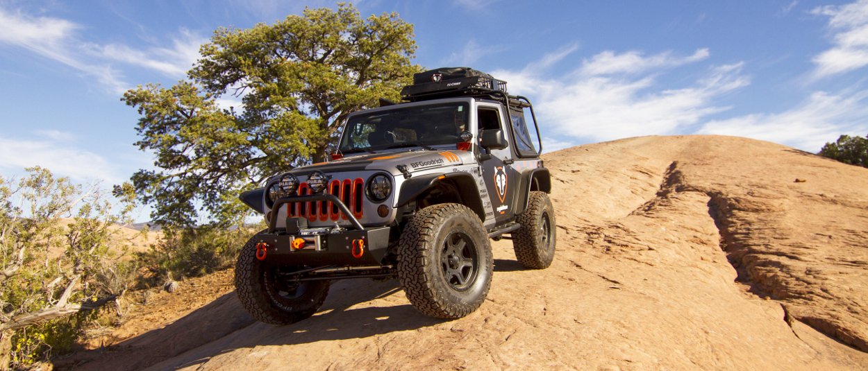 CURT rooftop cargo carrier on offroad Jeep Wrangler