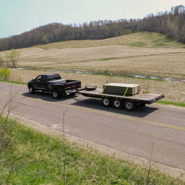 Triple axle trailer towed by truck