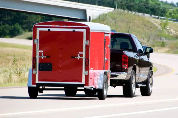 Truck Pulling Enclosed Utility Trailer